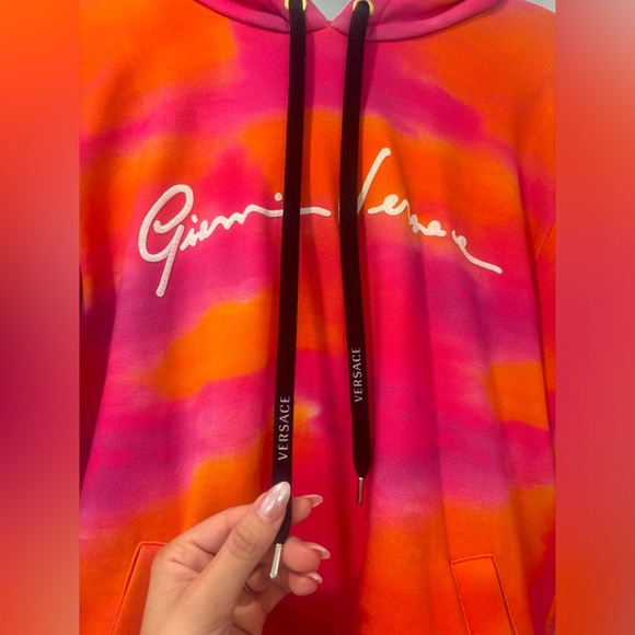 Versace sweater. Orange and pink. It’s like a woman small. - Picture 2 of 5